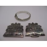 A nurse's silver buckle of pierced leaf form, Chester 1901, and a silver bangle [2].