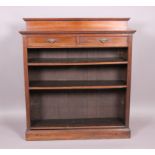 An Edwardian mahogany bookcase with low back over frieze drawer and adjustable shelves with fluted