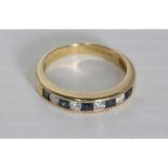 A half hoop eternity ring set with diamonds and square cut sapphires in 18ct gold [approximate