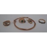 Three stone set fashion rings, a "hand" pendant and damaged bangle [5].