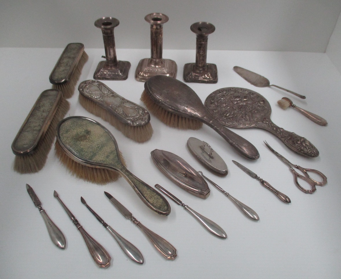 Dressing table brushes with silver backs, dwarf candlesticks, manicure tools, etc. [a lot].