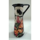 A Moorcroft baluster jug in "Miss Alice" pattern, 24 cm.