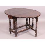 An early 18th century oak gate-leg dining table,