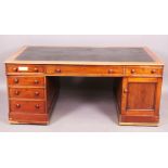 A Victorian mahogany partners' desk each side with three frieze drawers over a pedestal of three