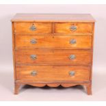 An Early 19th Century mahogany chest of two short and three long drawers on out-curved bracket feet