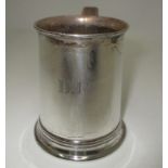 A silver Christening mug of tapered cylindrical form by Thomas Bradbury & Sons, Sheffield 1920, 8.