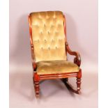 A Victorian mahogany frame rocking chair with buttoned upholstered back and open scroll arms,