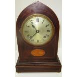 A Coventry Astral movement lancet shape mantel clock in walnut case with Roman numerals to dial