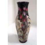 A Moorcroft baluster vase in "Town of Flowers at Christmas" pattern, signed Kerry Goodwin, 25.5 cm.