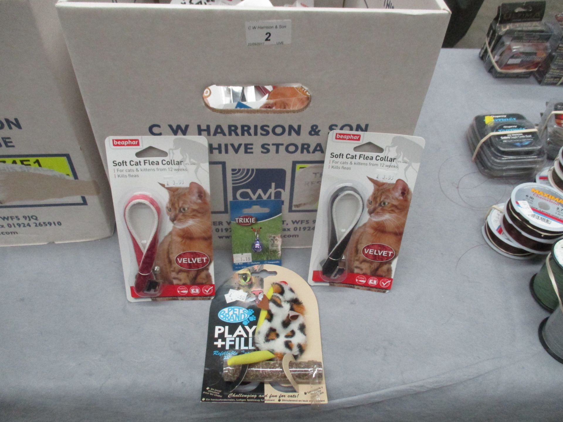 Contents to box - cat toys, cat collars, cat litter,