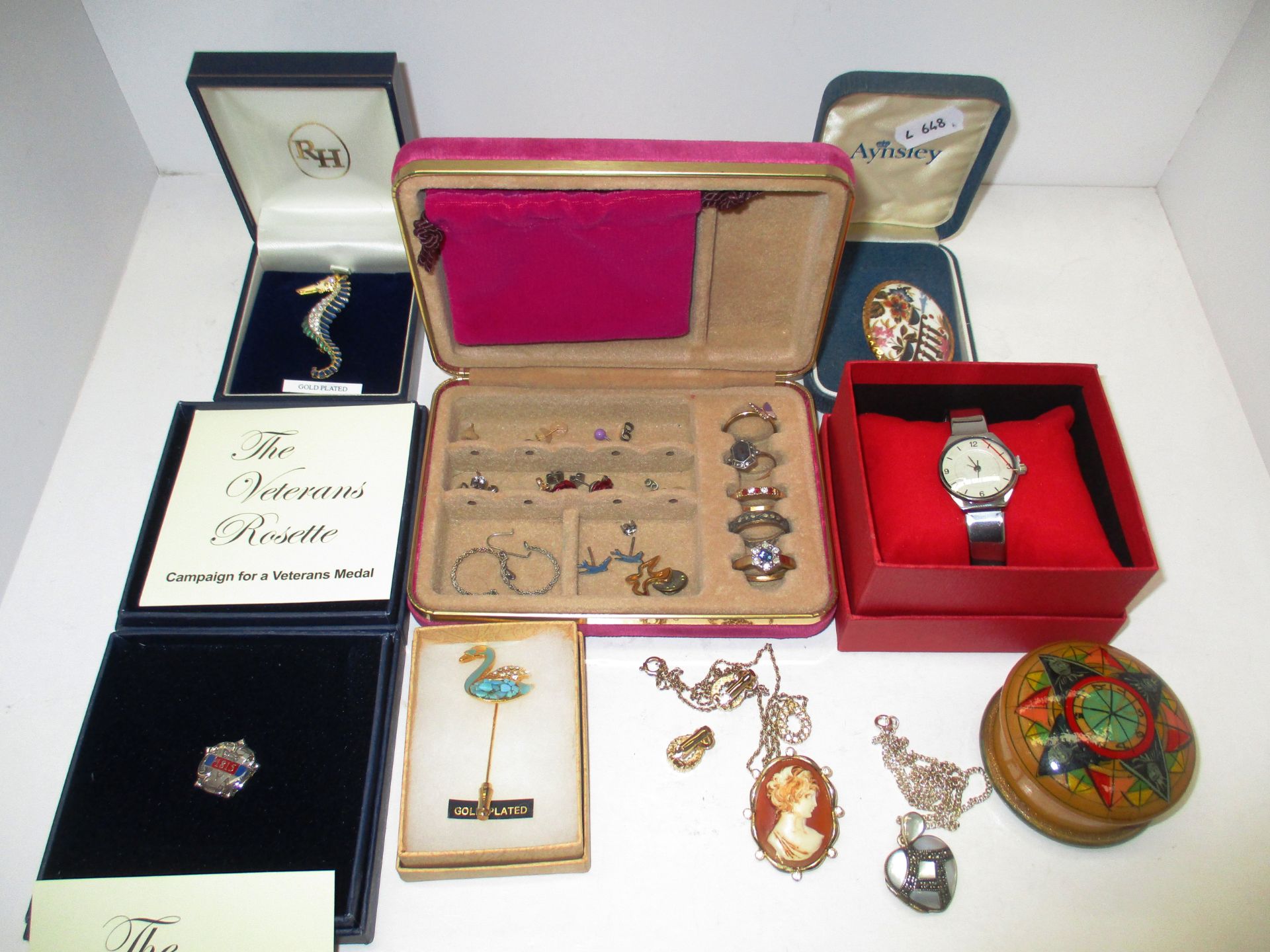 Contents to box - 5 assorted dress rings, 6 pairs of assorted earrings, a ladies wristwatch,
