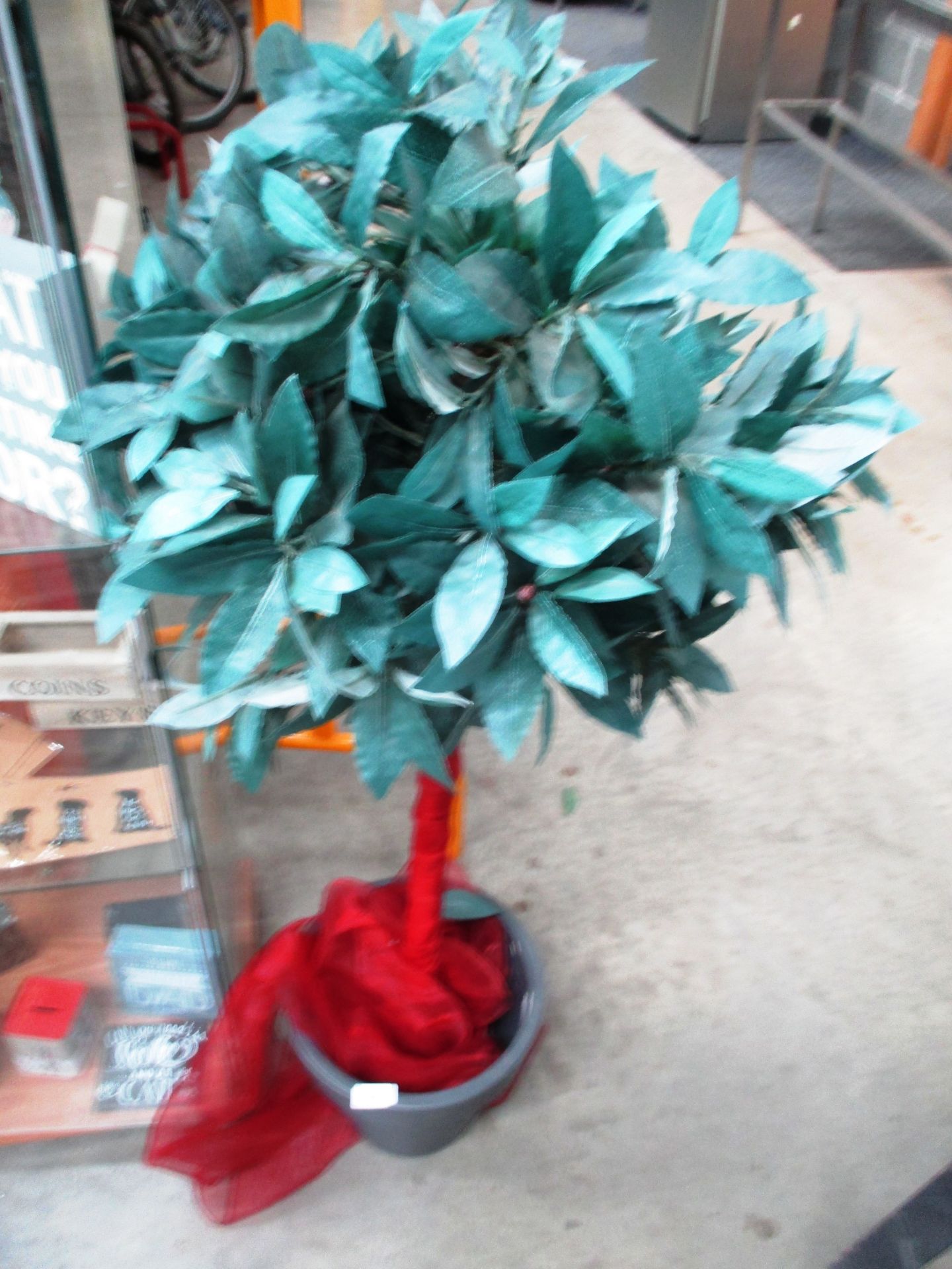 Artificial tree in grey plastic pot