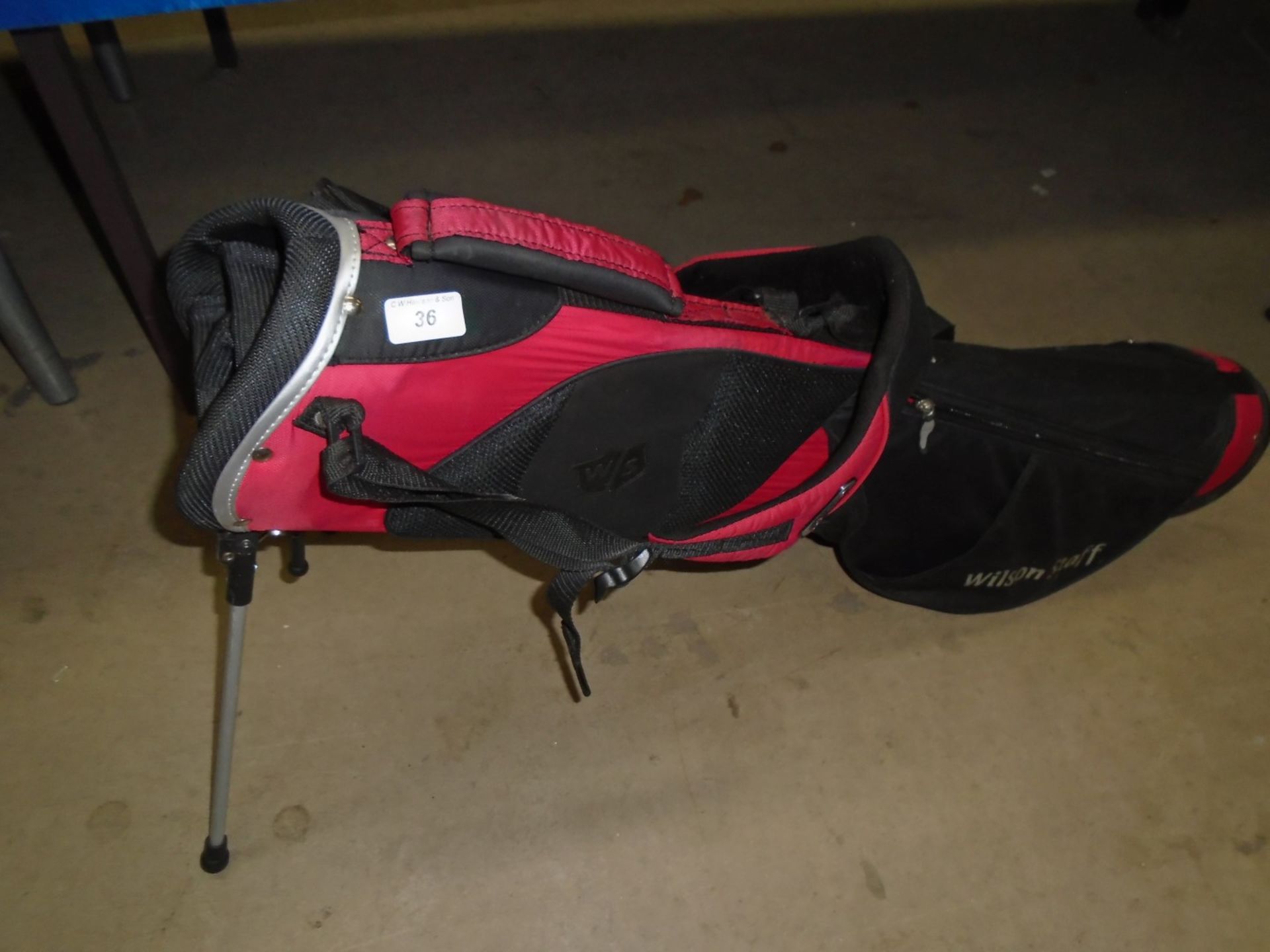 A Wilson Staff red and black junior golf stand bag