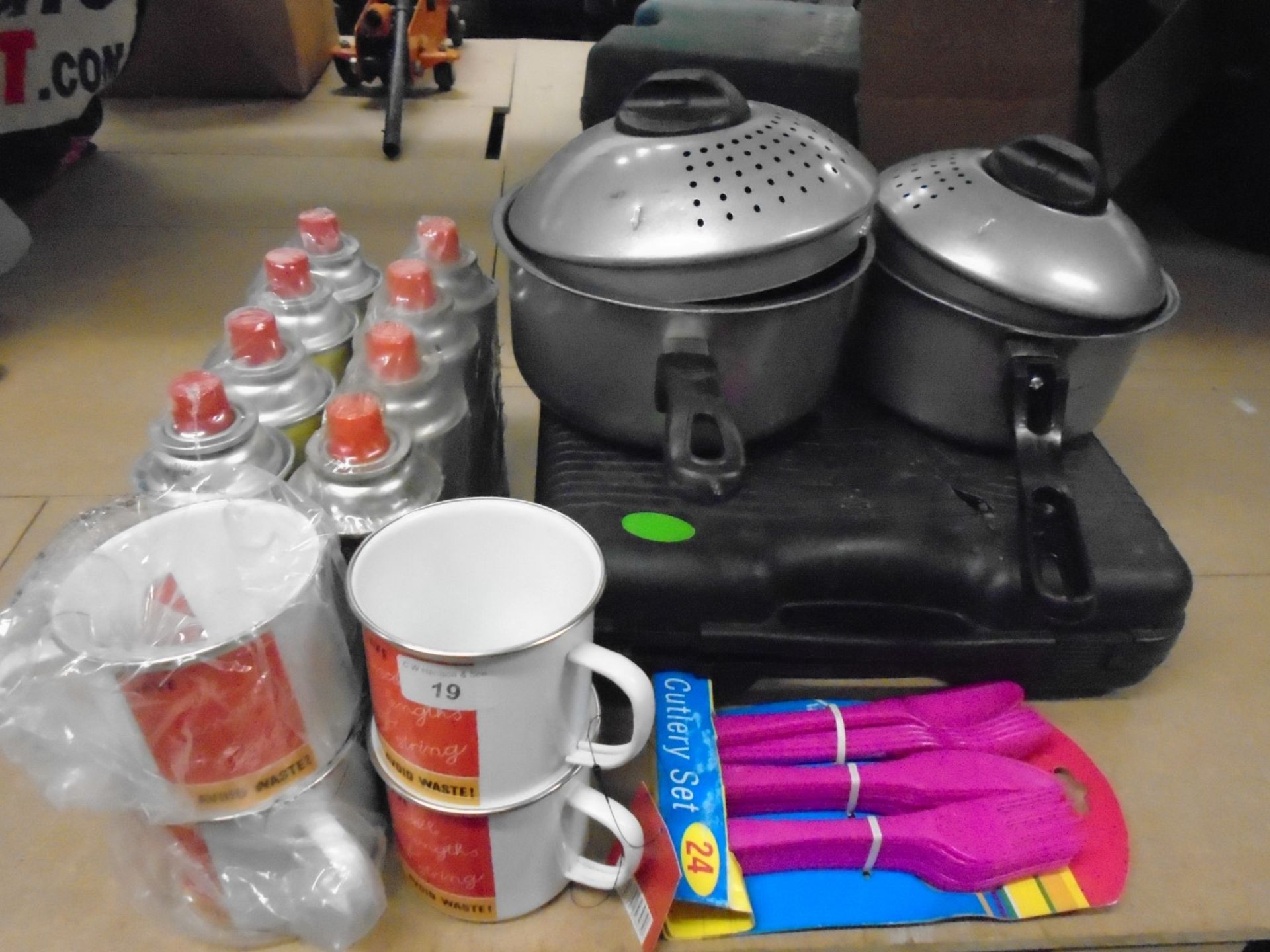 Pots and pans, camping stove, cups, plastic knives, Butane gas canisters,