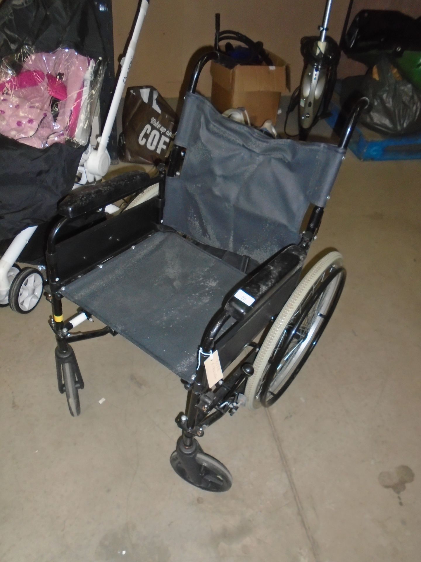 A black metal four wheeler wheel chair