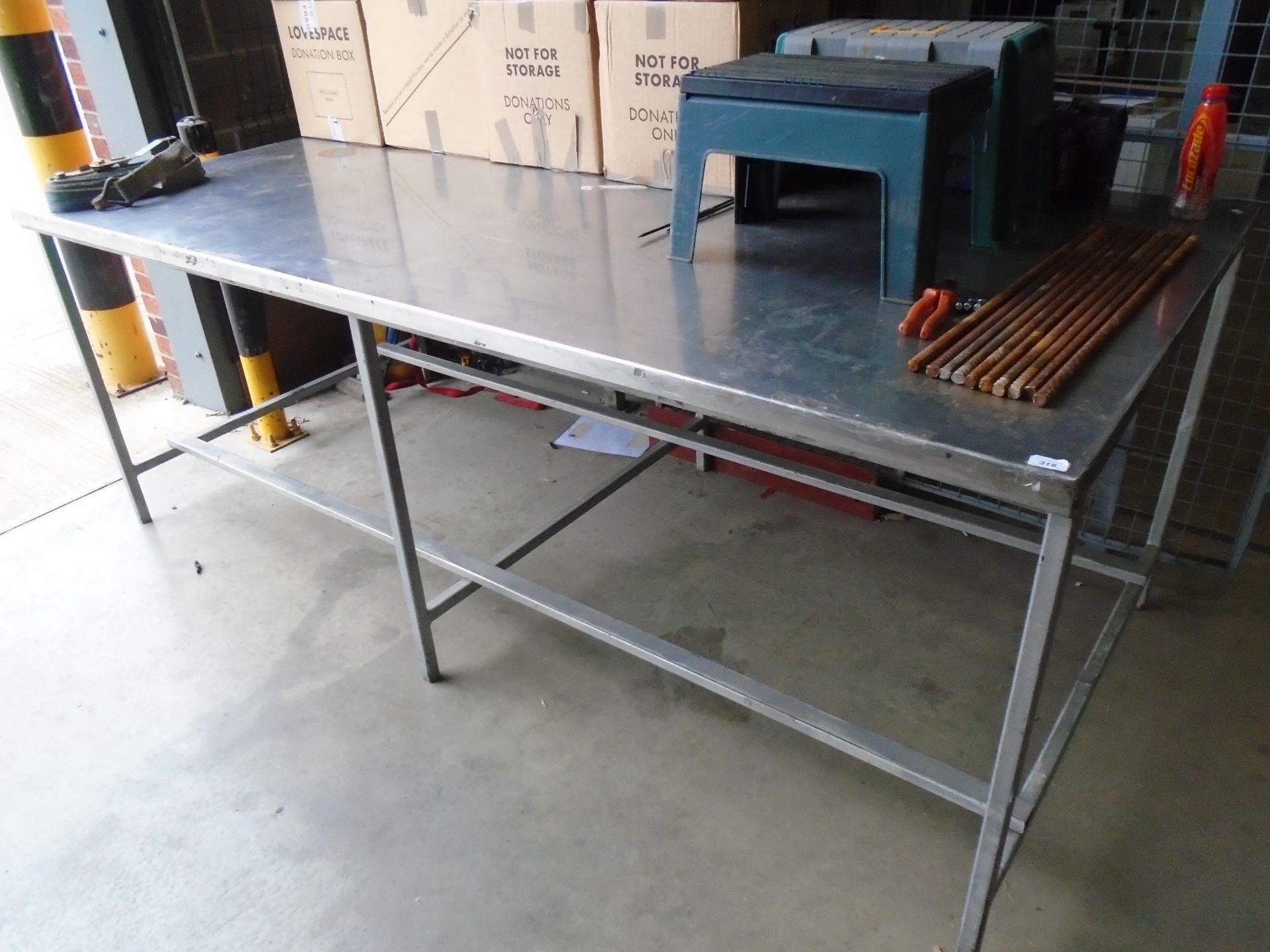 A stainless steel large preparation table 120 x 245cm