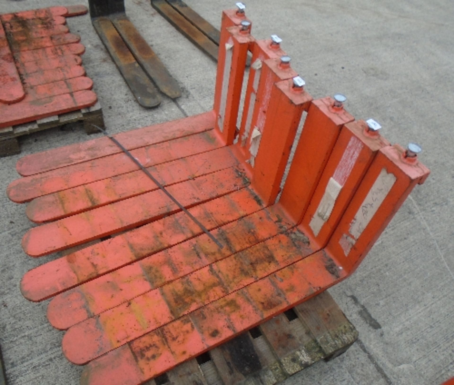 A pair of orange metal forklift truck front forks 12 x 92cm