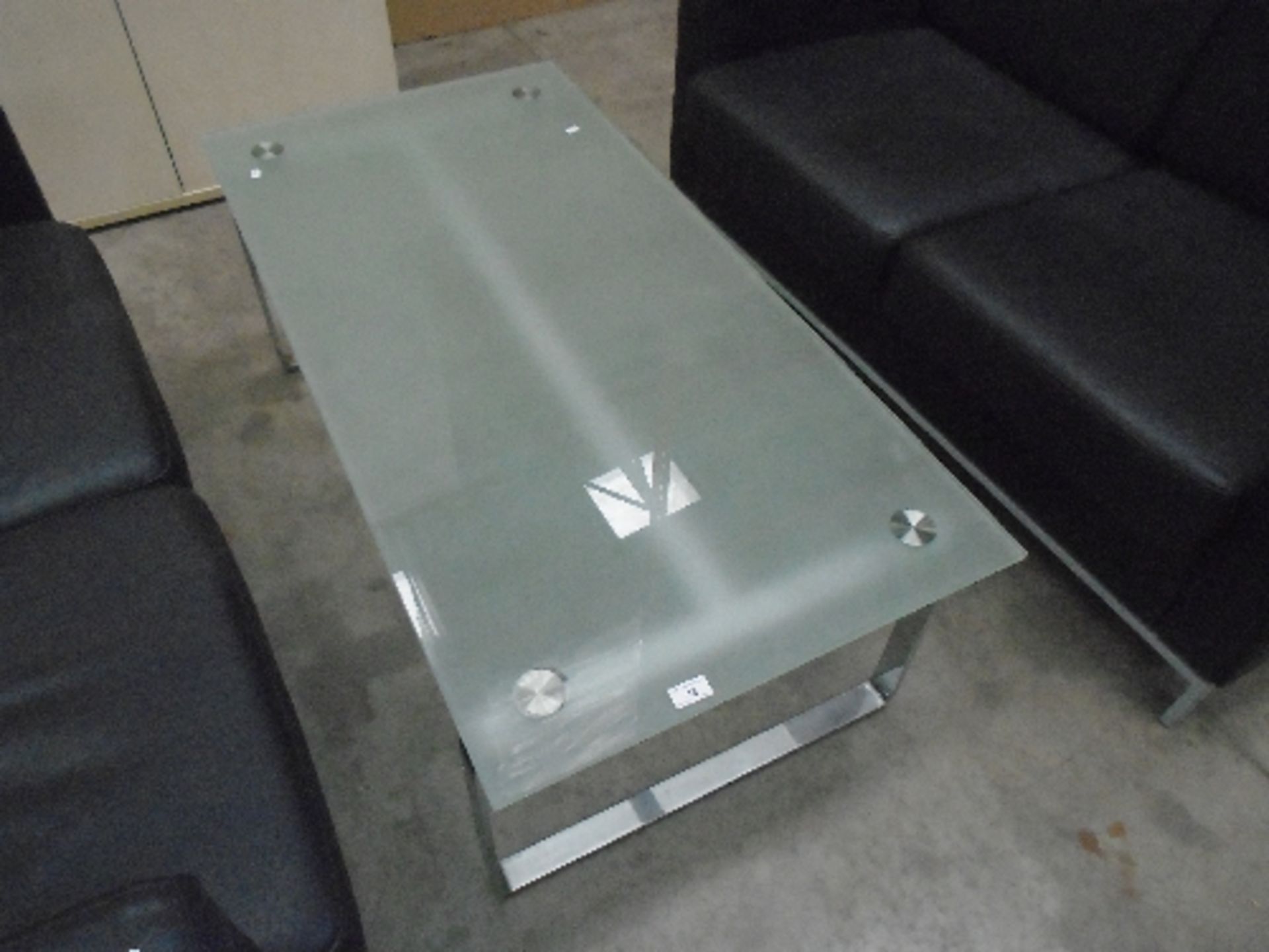 A frosted glass top coffee table on grey metal base 60 x 120cm