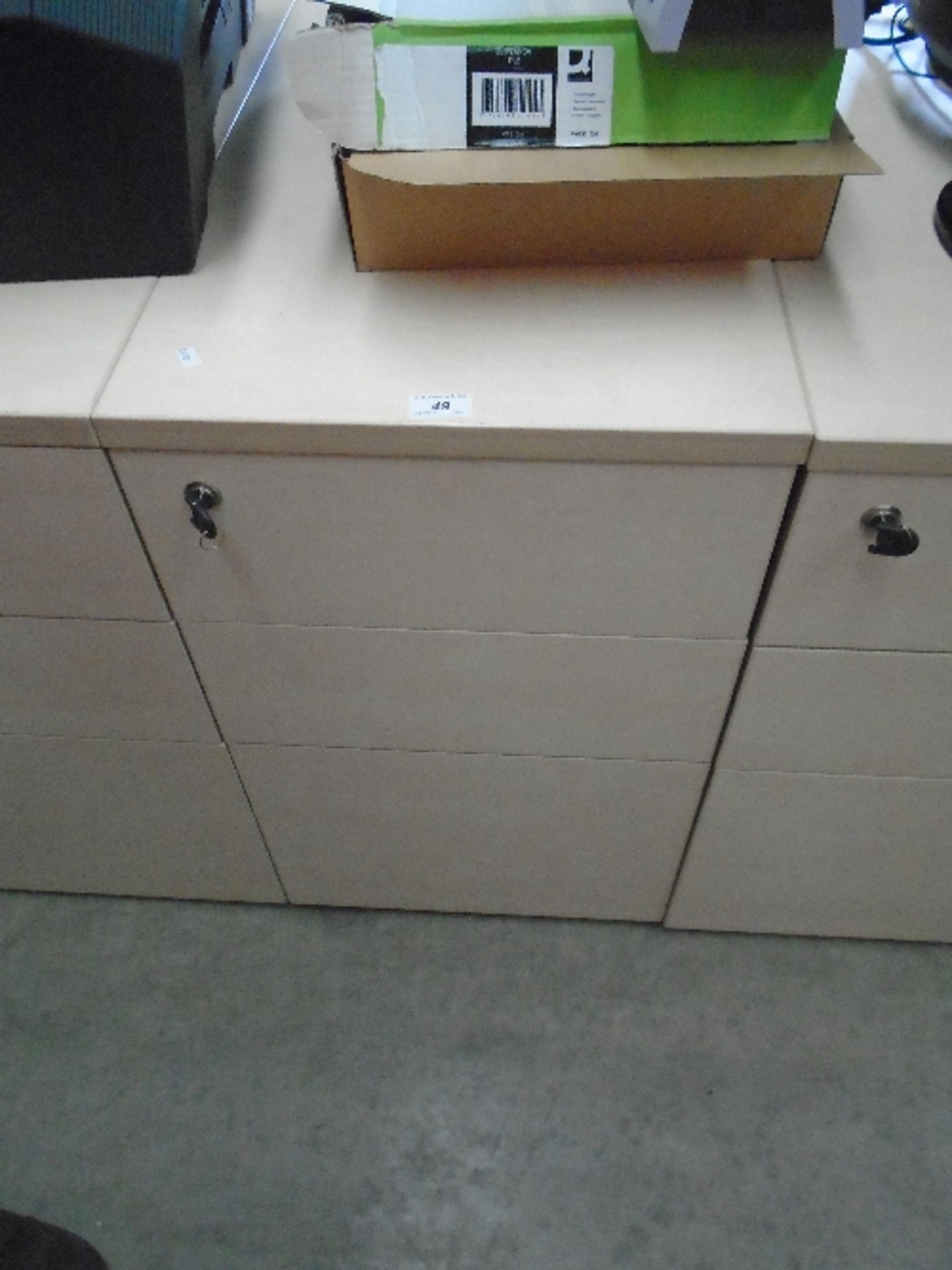 A maple finish three drawer pedestal (keys)