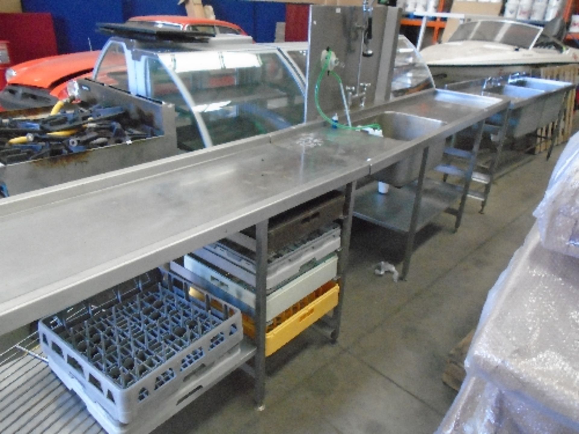A stainless steel commercial wash station with under shelves 64 x 370cm (2 sections),