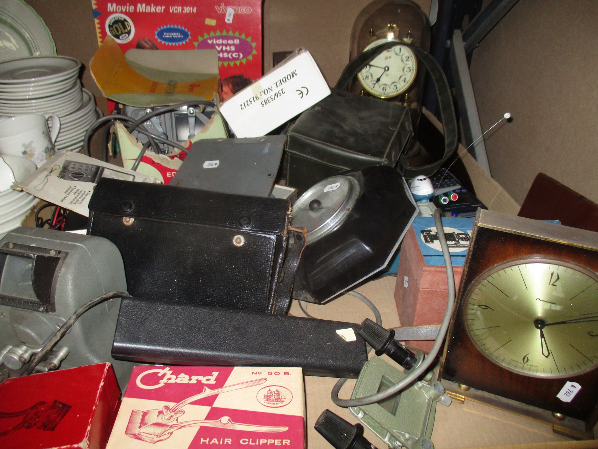 Contents to tray - an assortment of items including vintage hair clippers, Dominion mantel clock,