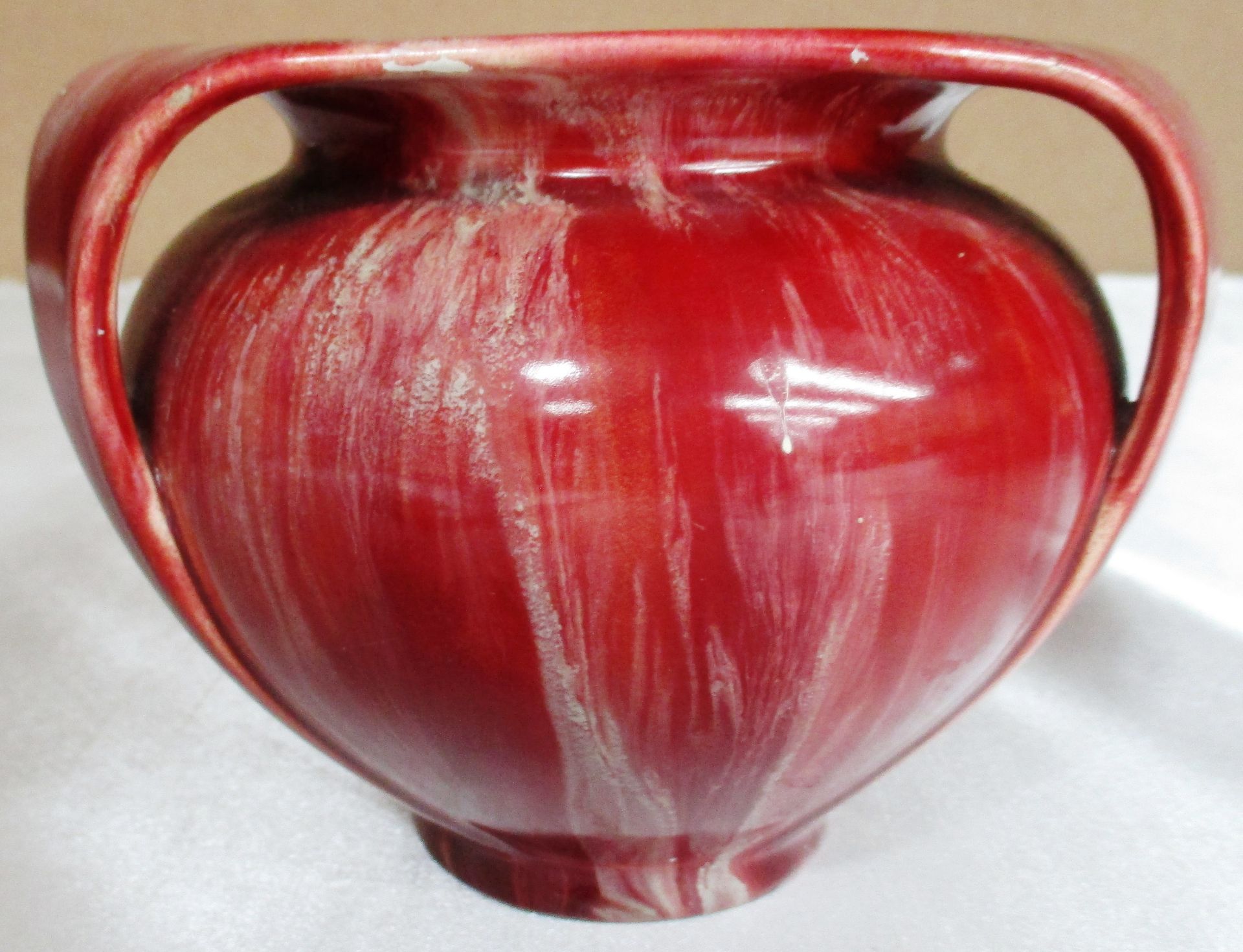 An Art Nouveau pottery tyg jug with a red glaze - manufacturers mark to the base Further - Image 2 of 12