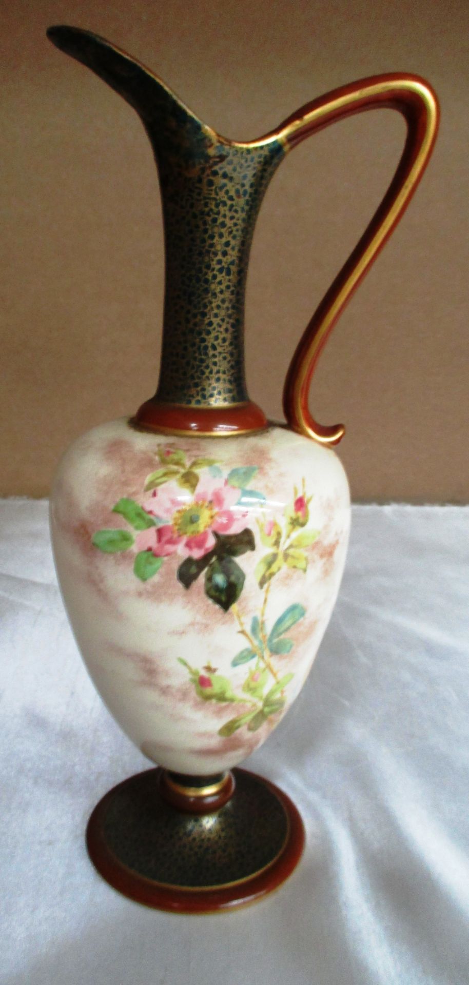 A Doulton Burslem handled jug with floral decoration