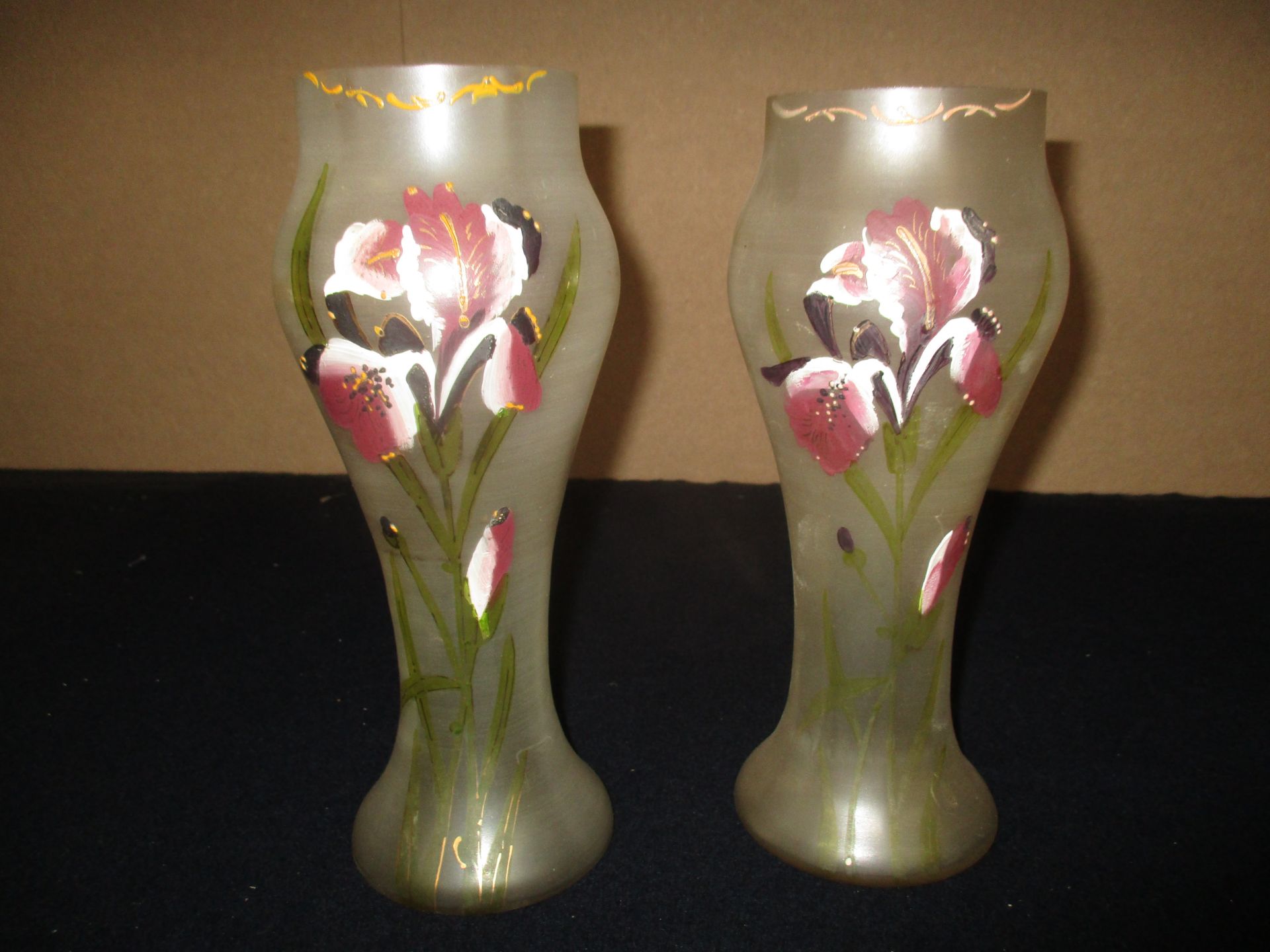 A pair of Iridescent floral painted glass vases