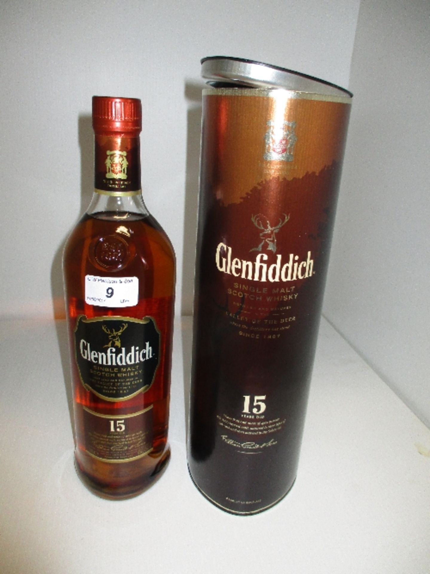 A litre bottle of Glenfiddich 15 years old single malt Scotch Whisky in presentation tube