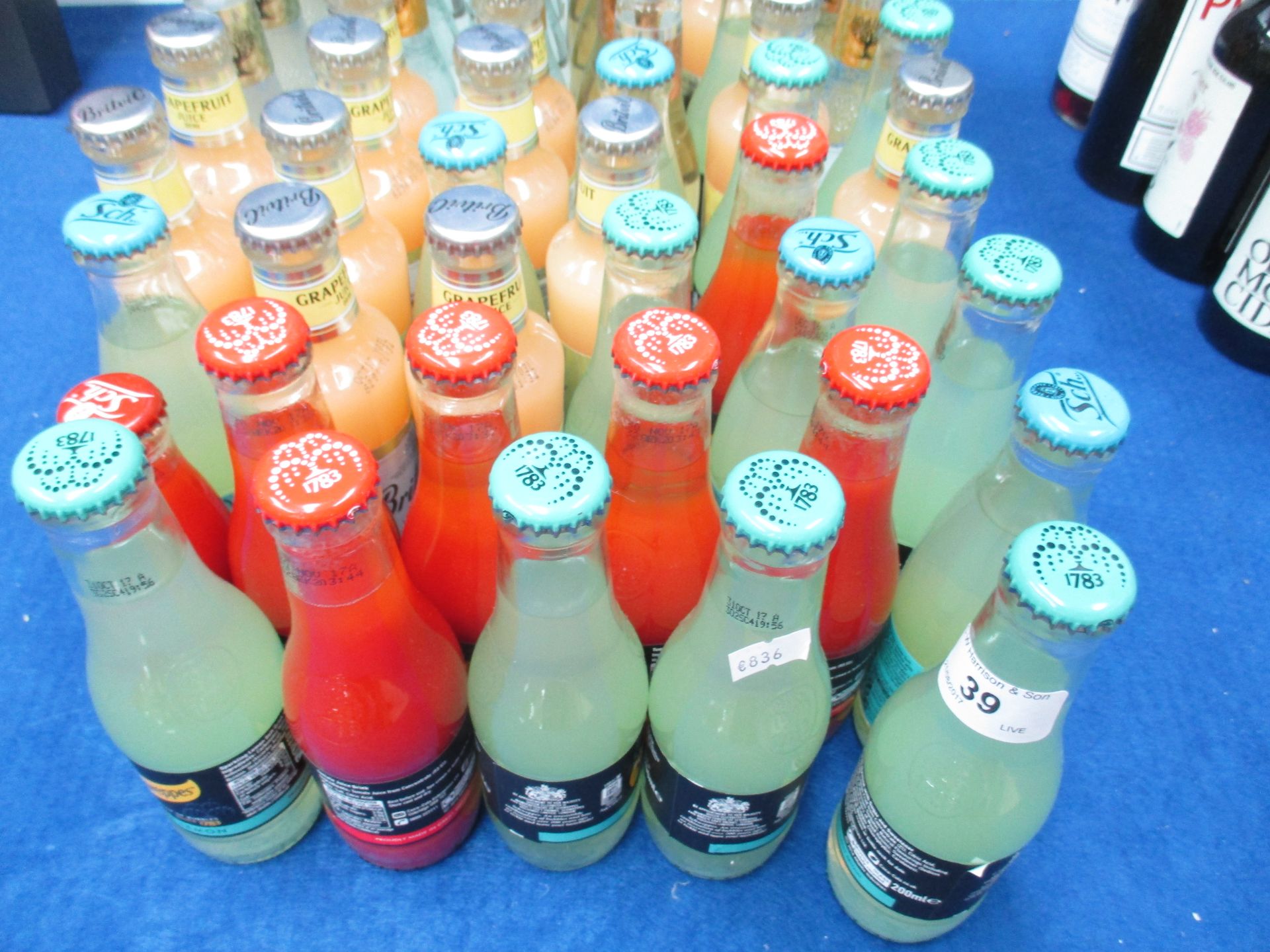 65 x 125ml, 200ml bottles of Schweppes, tomato juice,