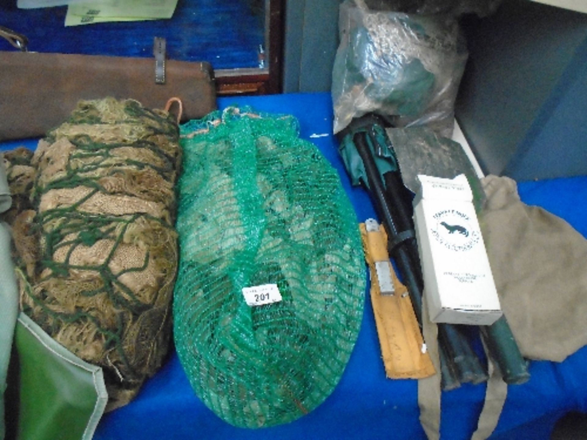 Camoflage nets, small folding spade, folding knife, ferret finder,