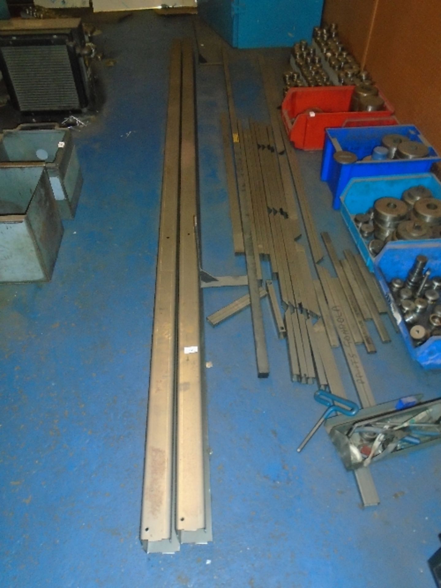 A quantity of galvanised metal bars, brackets,