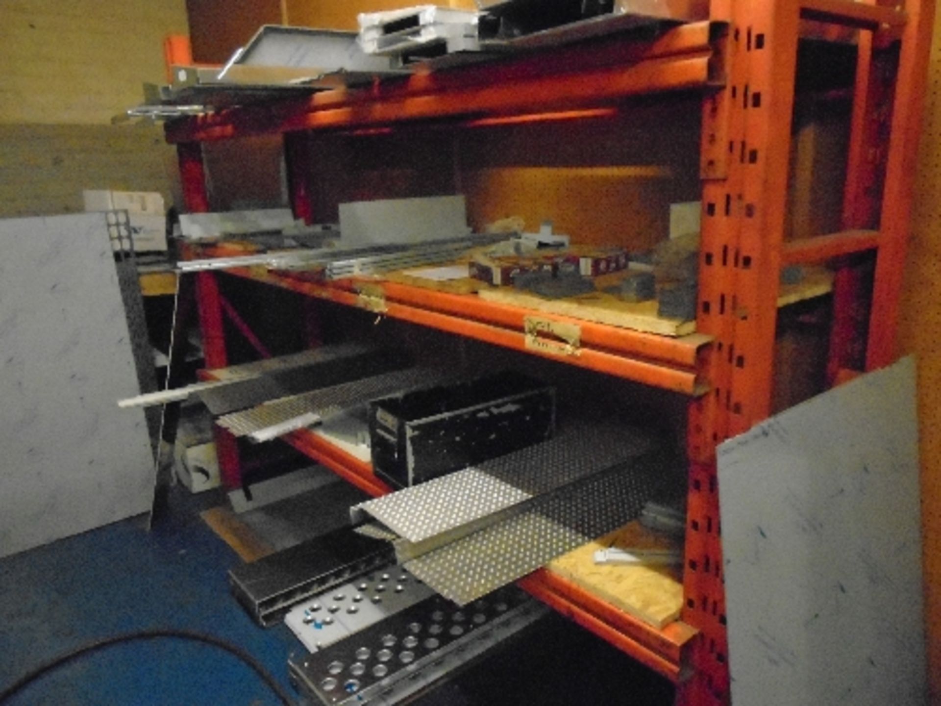 A red metal three shelf storage rack 60 x 187 x 247cm