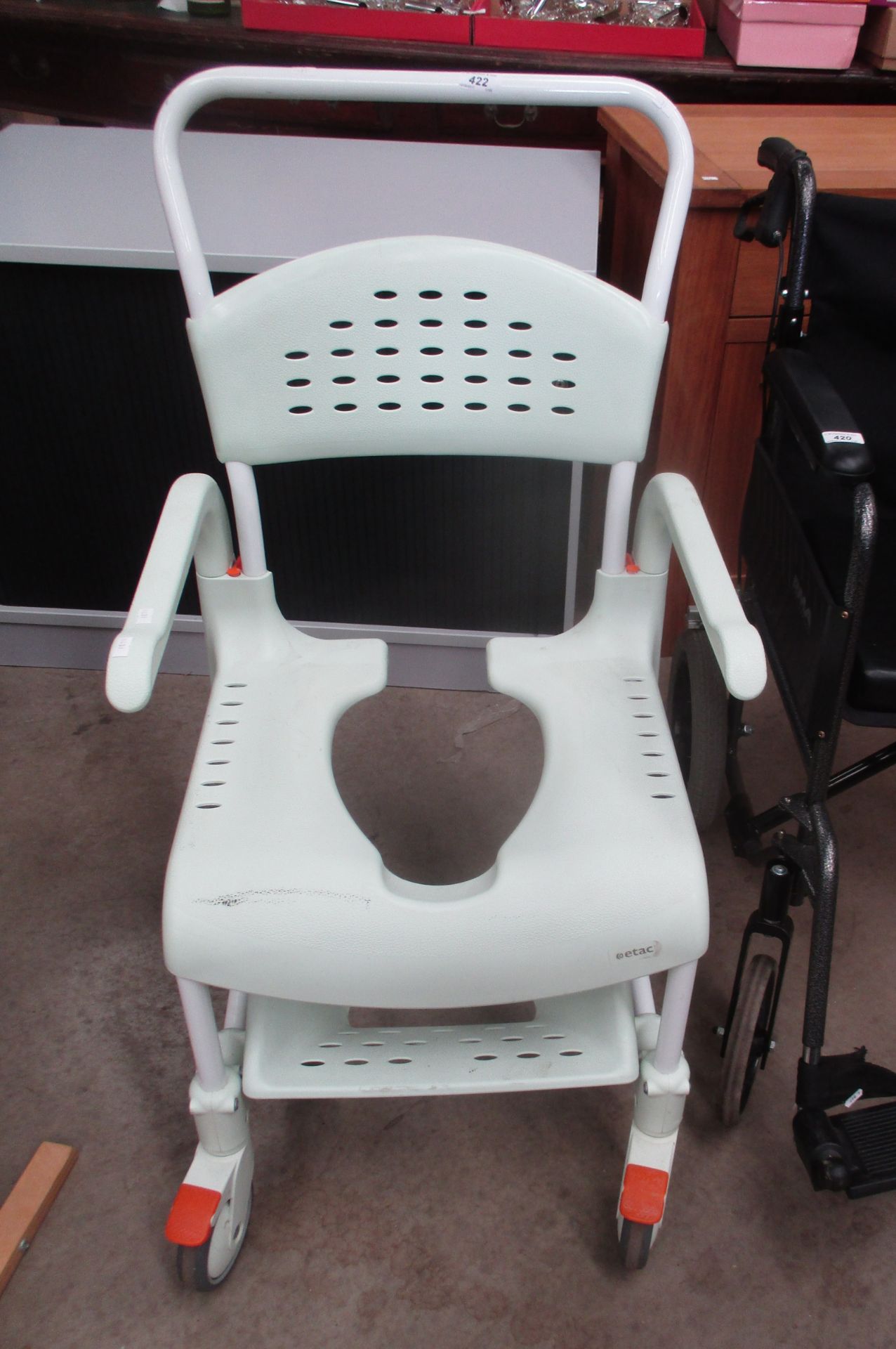 An Etac mobile shower chair