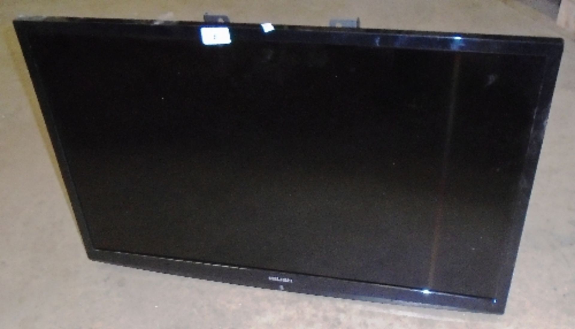 A Bush DLED3216HD 32" LED TV - power lead, no stand or remote control complete with wall brackets