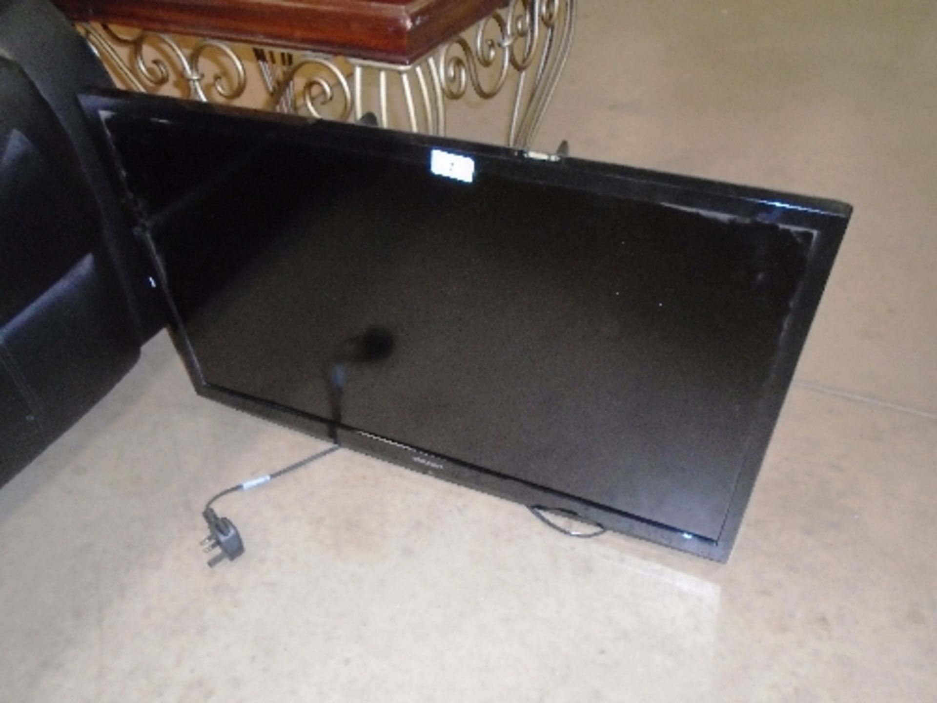 A Bush DLED3216HD 32" LED TV - power lead, no stand or remote control complete with wall brackets