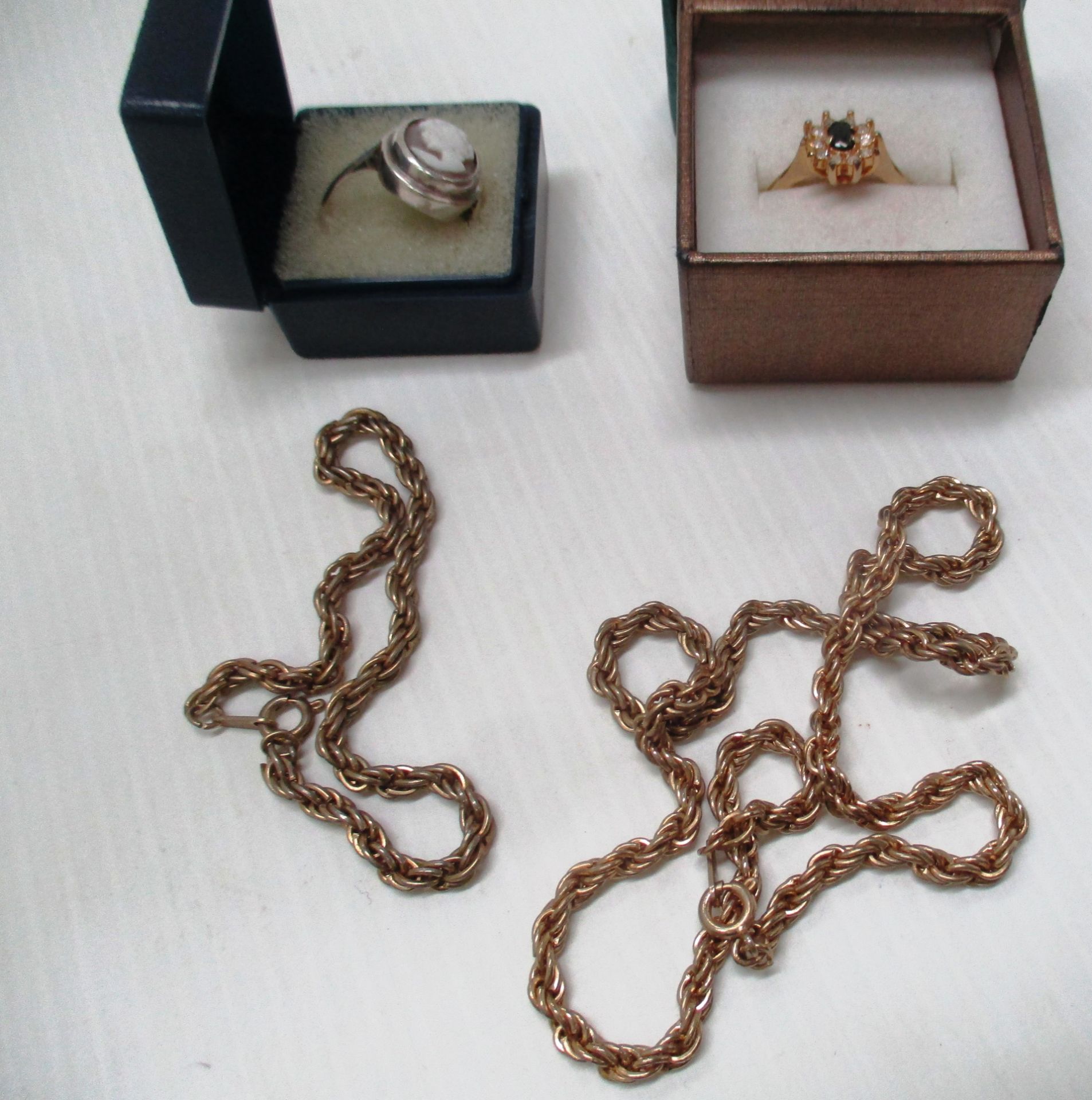 A gold coloured chain and bracelet,