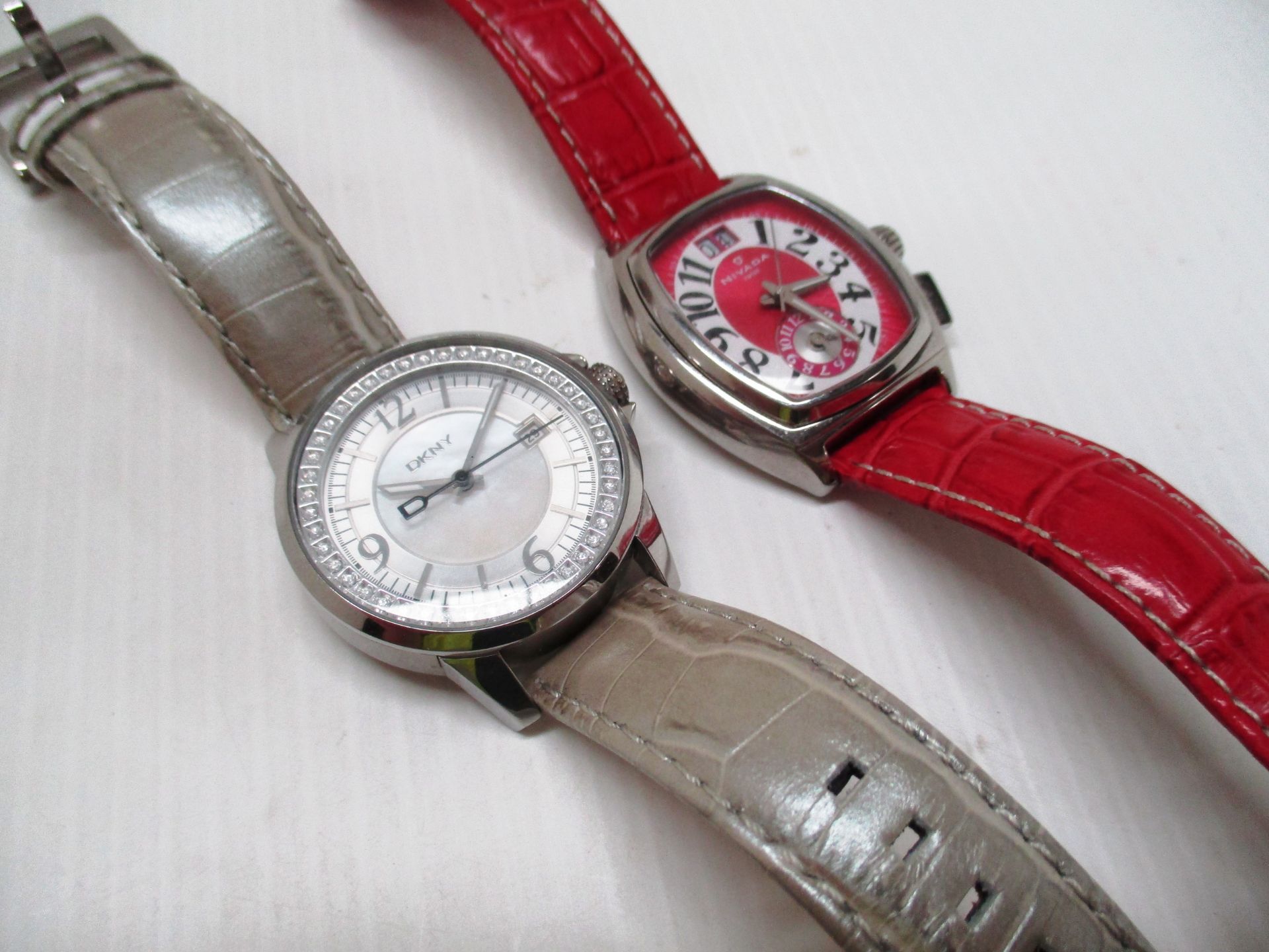 A ladies DKNY wristwatch with crocodile skin effect leather strap and a ladies Nivada wristwatch
