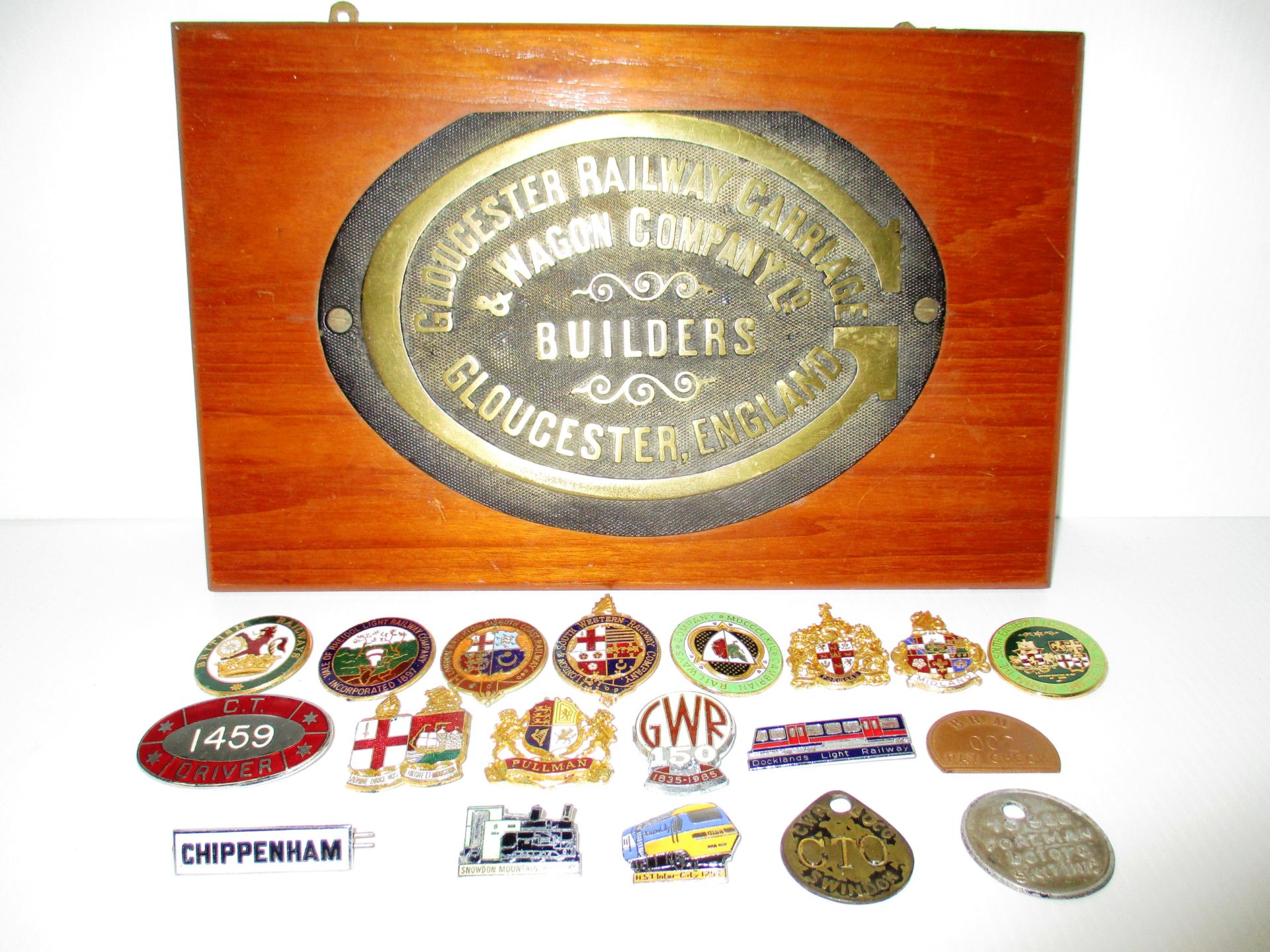 A Gloucester Railway Carriage and Wagon Company plaque mounted on wooden plinth and a quantity of