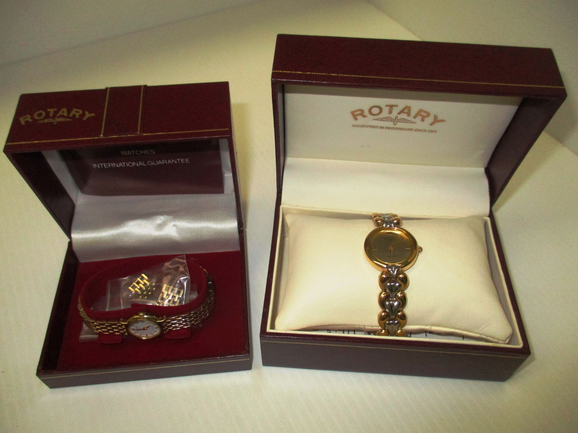 A ladies Rotary wristwatch with a gold coloured strap and another ladies Rotary wristwatch with