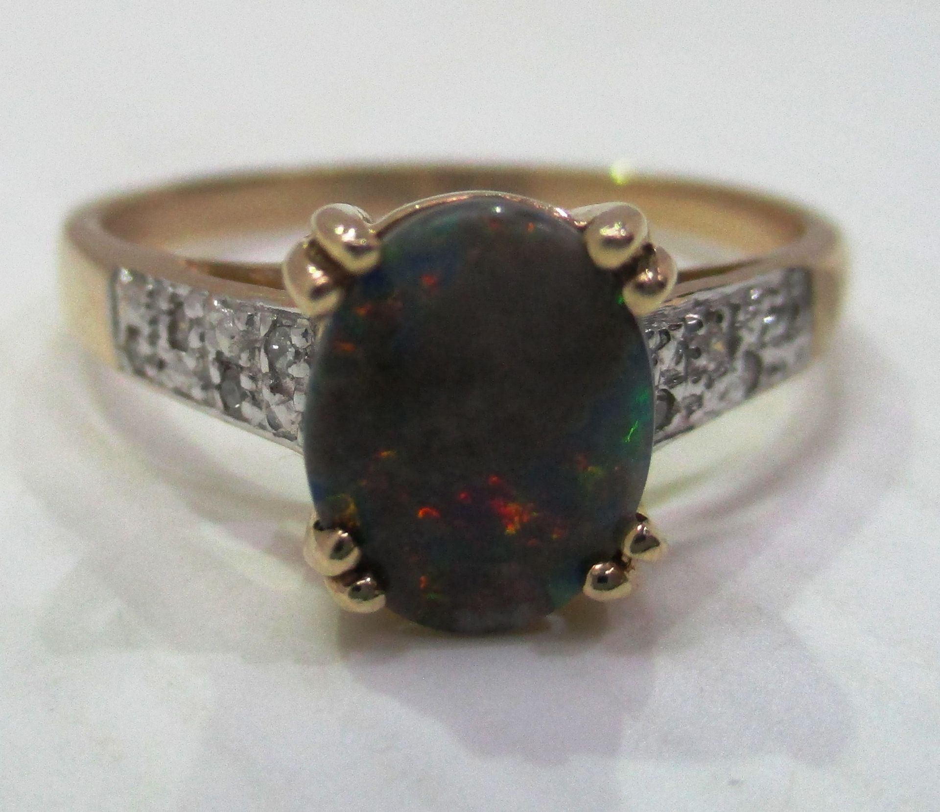 A 9ct gold solitaire ring set with blue opal like stone (total approx weight 2.