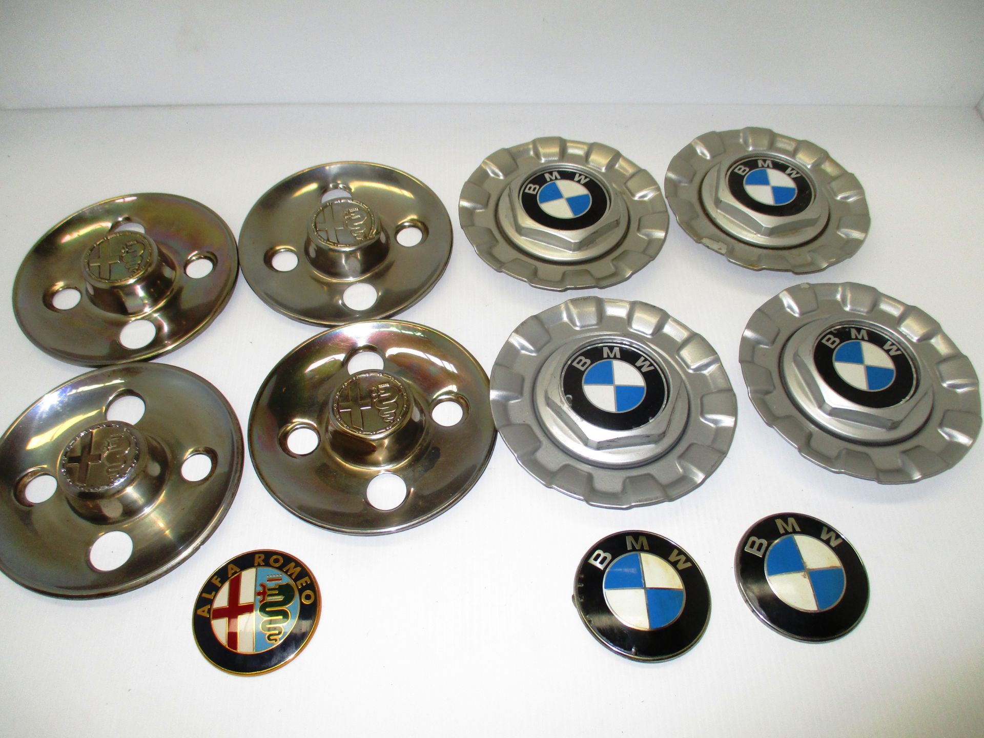 A set of 4 BBS BMW centre wheel hub caps, 2 BMW badges,