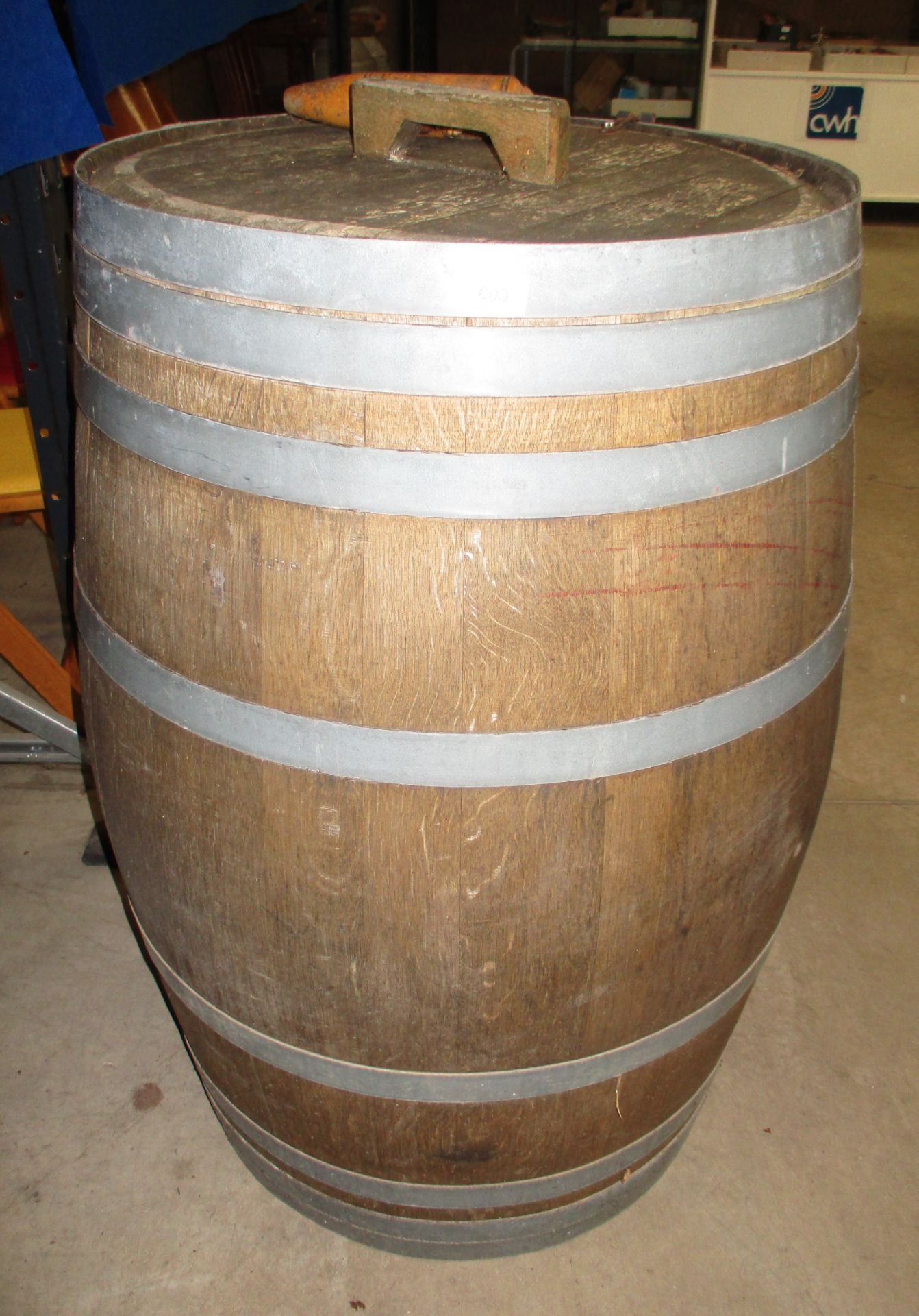 A large wooden barrel with metal banding - with wooden stop tap (97cm high)