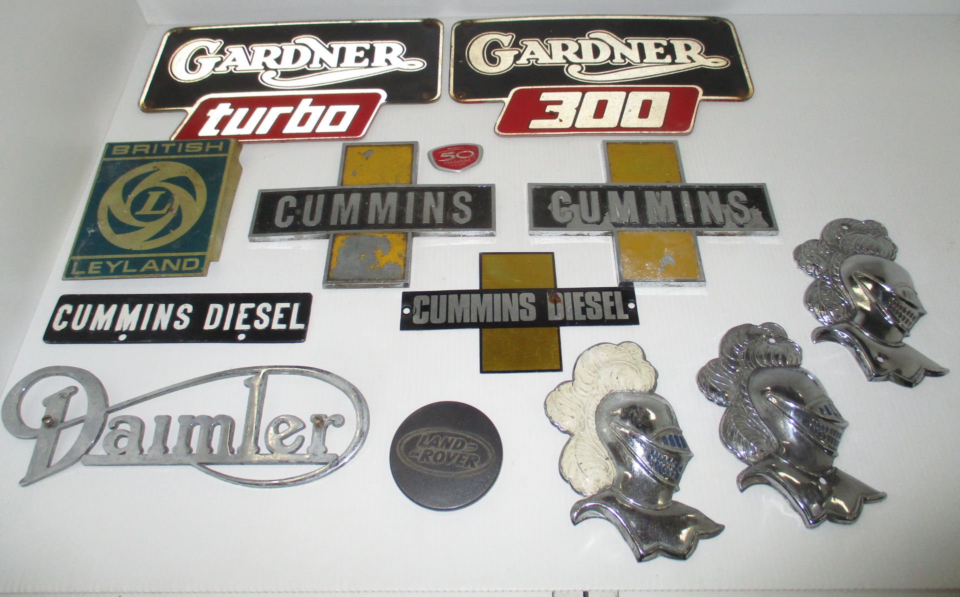 A quantity of assorted car and commercial badges - Daimler, Gardner, Cummins, Leyland, Land Rover,