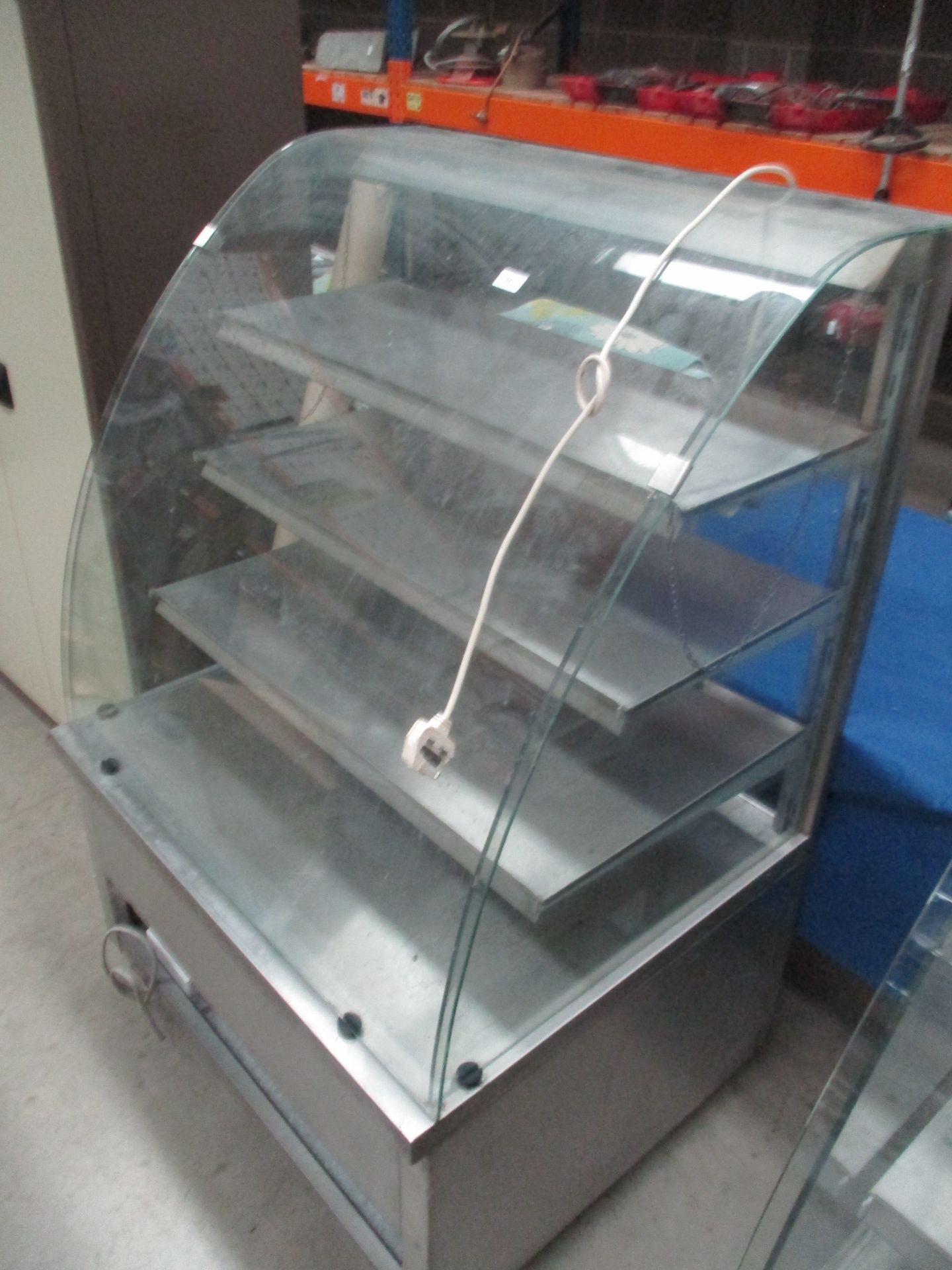 A stainless steel framed curved glass front mobile food display unit 90 x 137cm