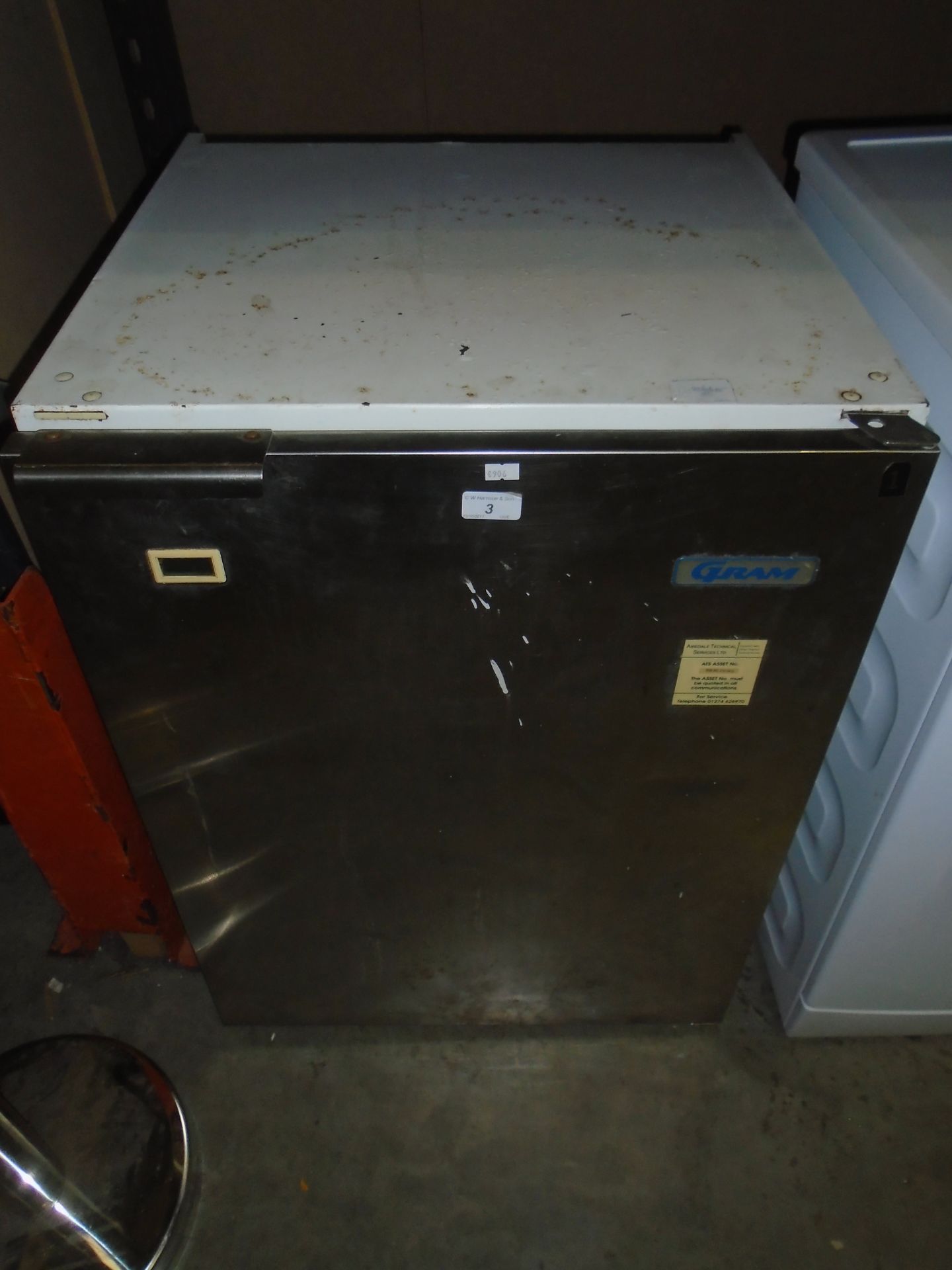 A Gram single door stainless steel under counter fridge (damaged flex cut off)