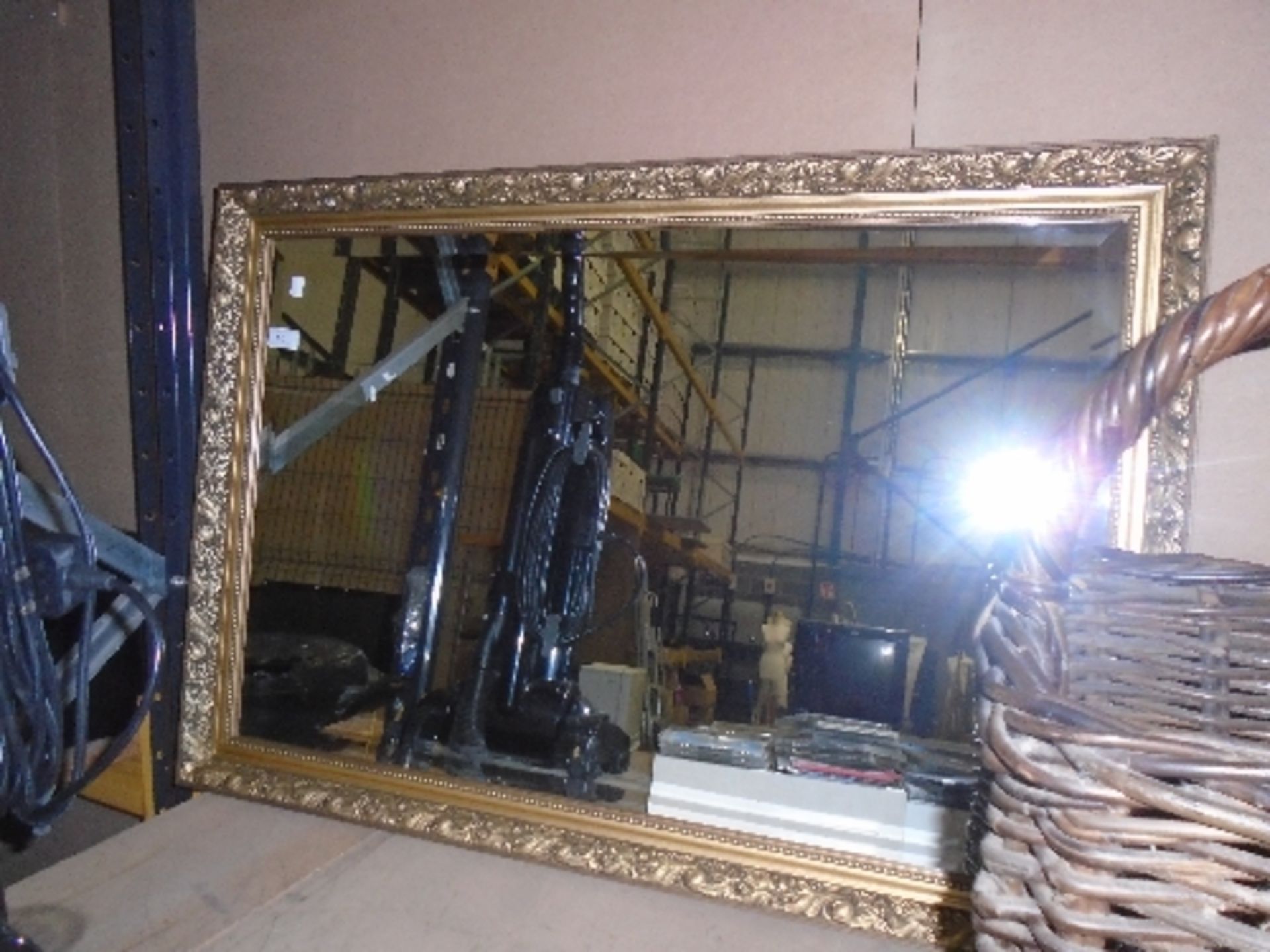 A gilt framed wall mirror