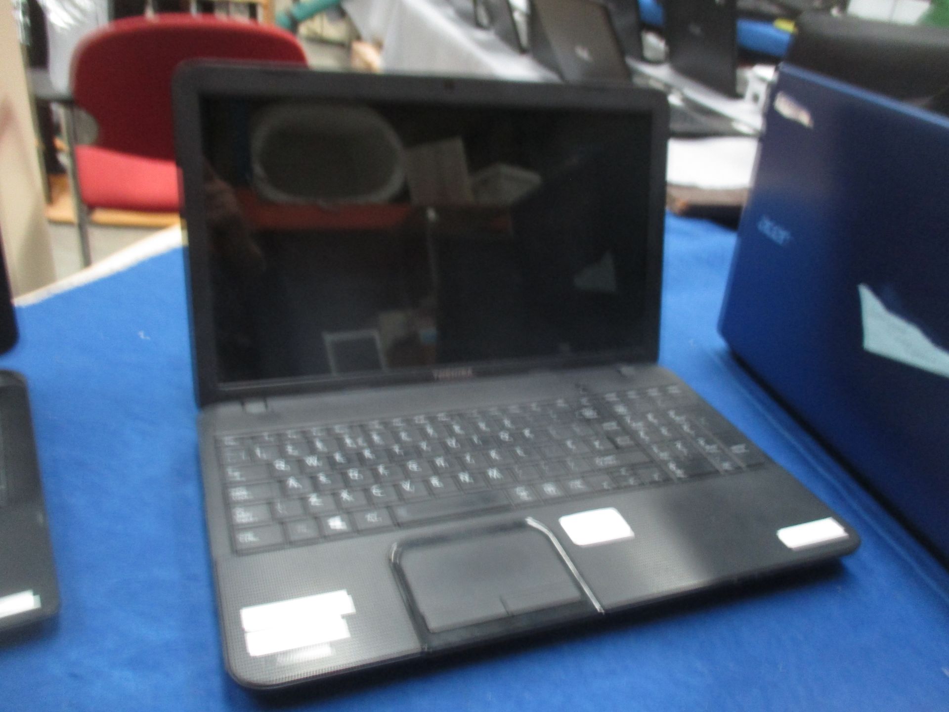 A Toshiba Satellite C850D-11Q laptop computer (with power lead)