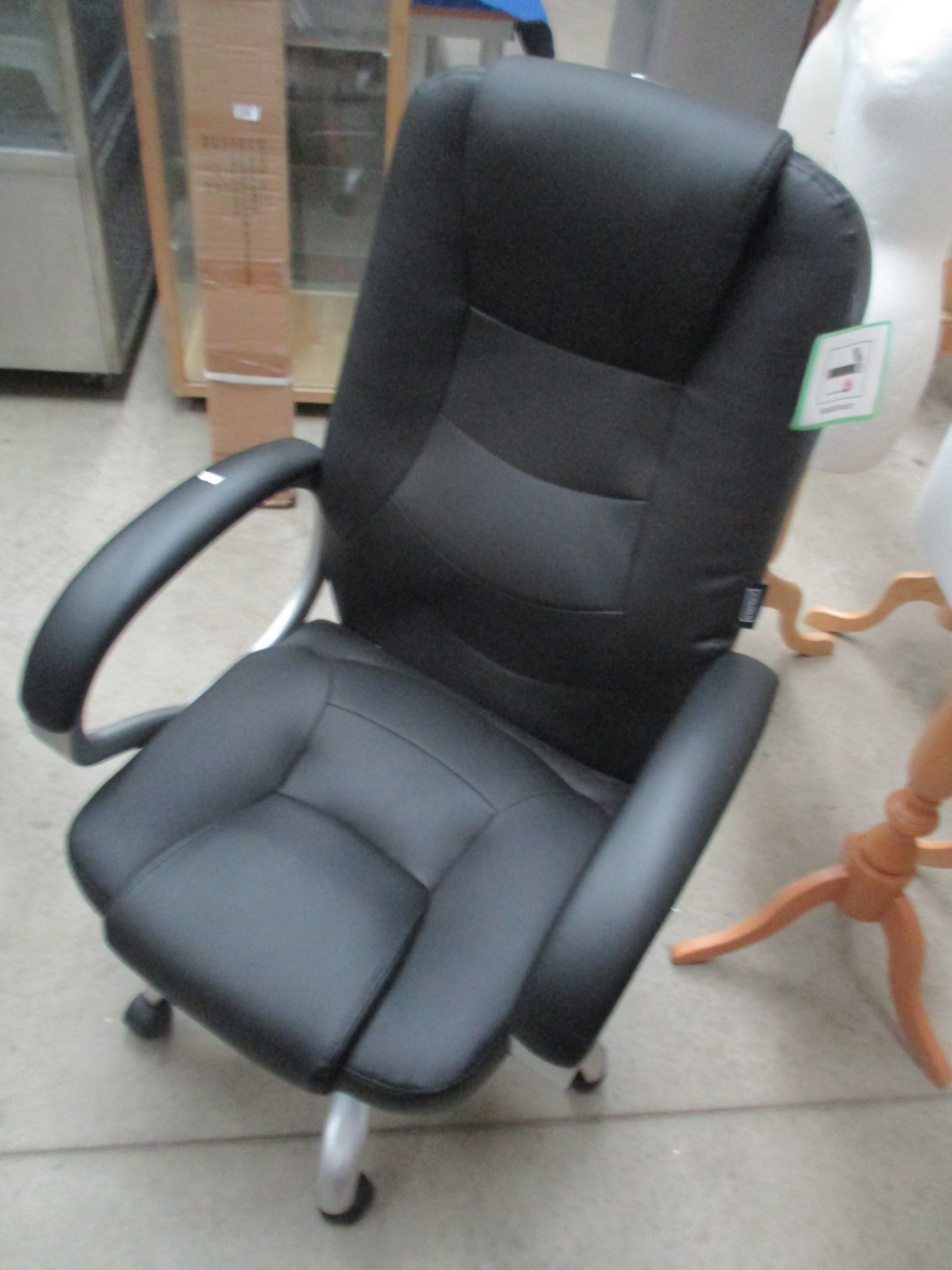 A black leather finish operators swivel armchair