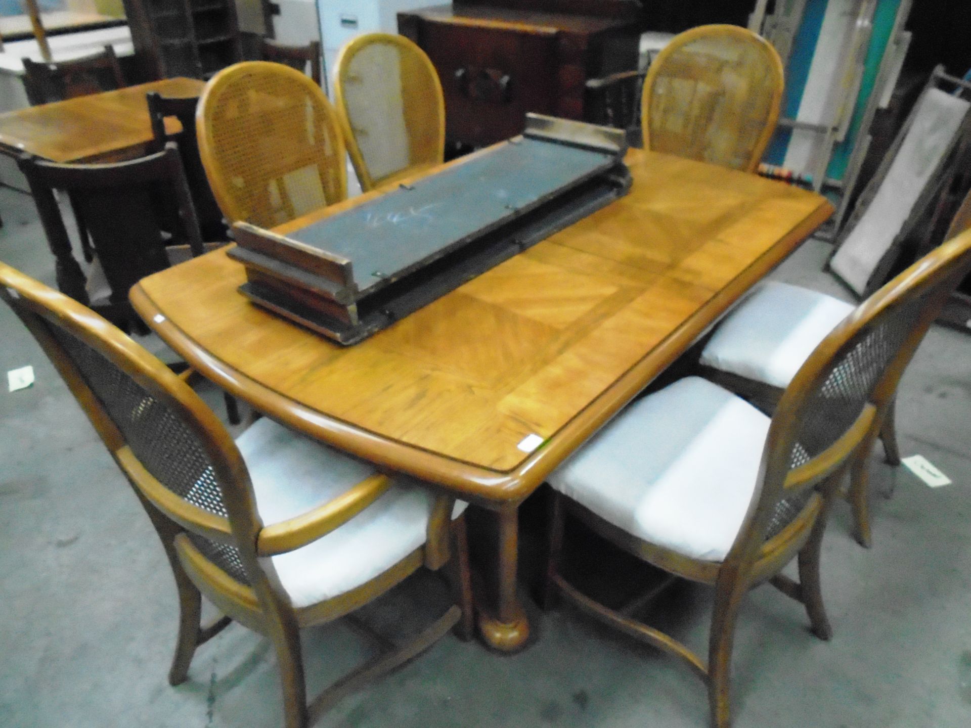 A pecanwood extending dining table 105 x 120cm complete with six matching chairs (2 carvers) with